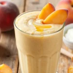 Creamy Dreamy Peach Smoothie Recipe with Frozen Peaches + Yogurt (Sunny, Creamy)